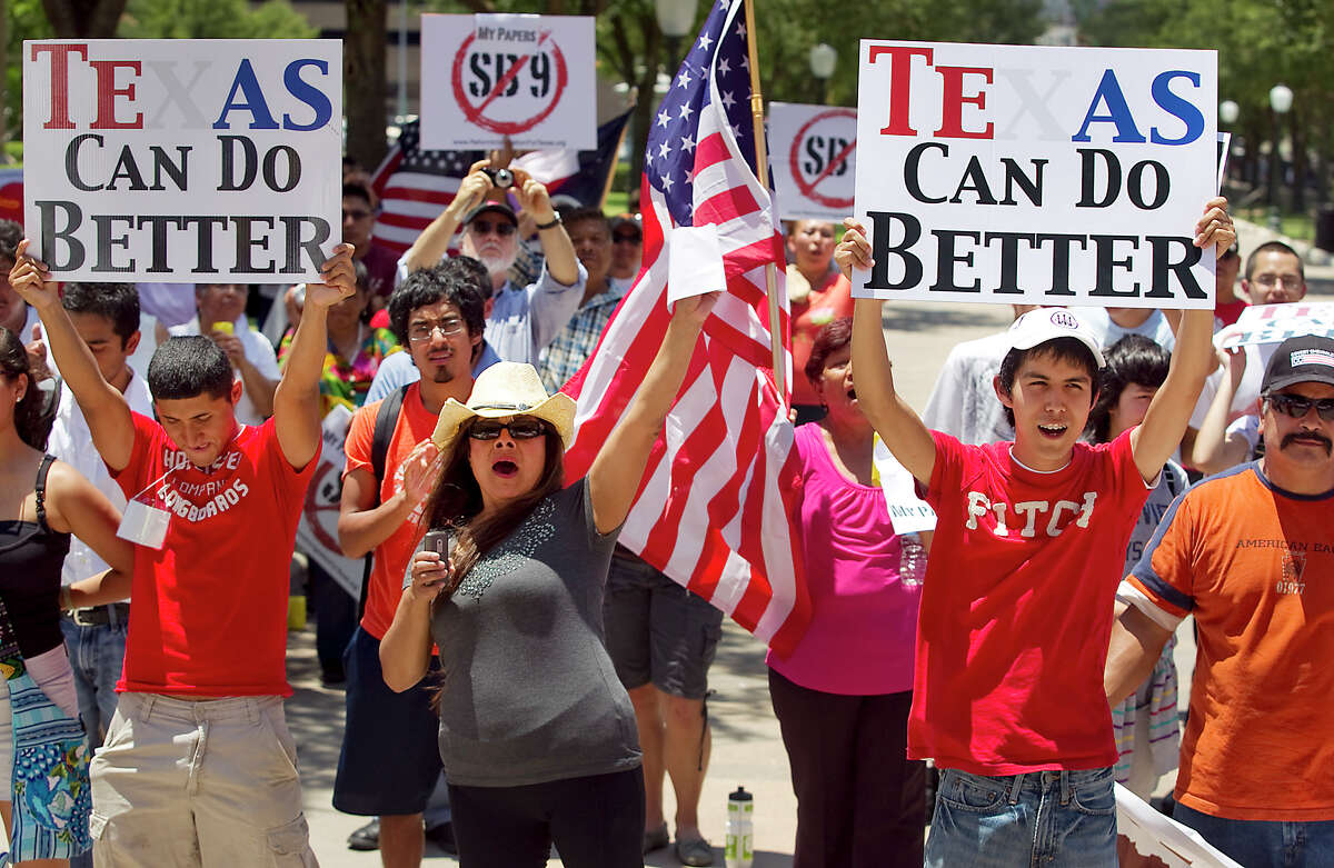 A large crowd gathers in 2011 on the south steps of the state Capitol to protest the Sanctuary Cities bill revived in the legislative special session and to rally against immigration bill proposals like SB9, in Austin, TexasWednesday, June 15, 2011.