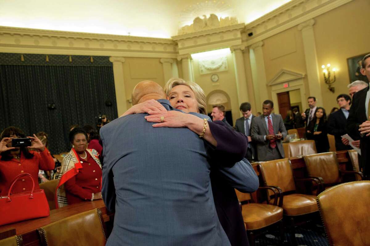 Democratic presidential candidate former Secretary of State Hillary Rodham Clinton hugs House Select Committee on Benghazi ranking member Rep. Elijah Cummings, D- Md., at the conclusion of a hearing on Capitol Hill on Thursday, Oct. 22, 2015, in Washington. (AP Photo/Jacquelyn Martin)