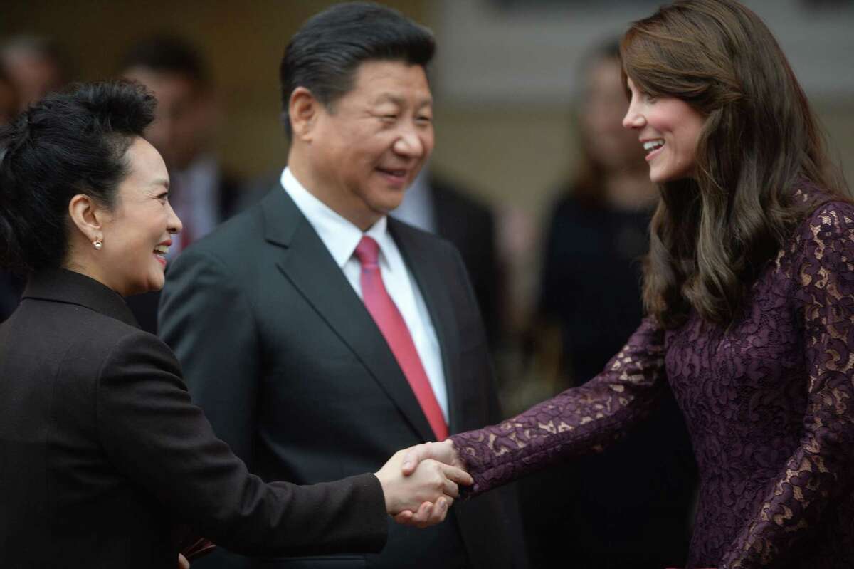 Kate, Duchess of Cambridge, greets President Xi Jinping and his wife, Peng Liyuan, at Lancaster House in London on Wednesday.