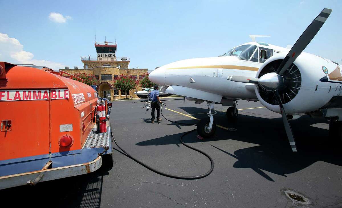 An employee from GateONE   fuels an airplane at Stinson airport. GateONE is one of several companies locating their facilities there as flight operations  grow.