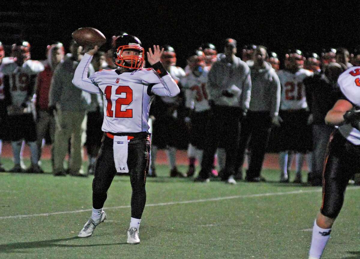 Ridgefield quarterback Drew Fowler throws a pass during a football game against Staples on Friday, October 23rd, 2015 in Westport, Connecticut. Fowler threw four touchdowns as Ridgefield won 31-27.