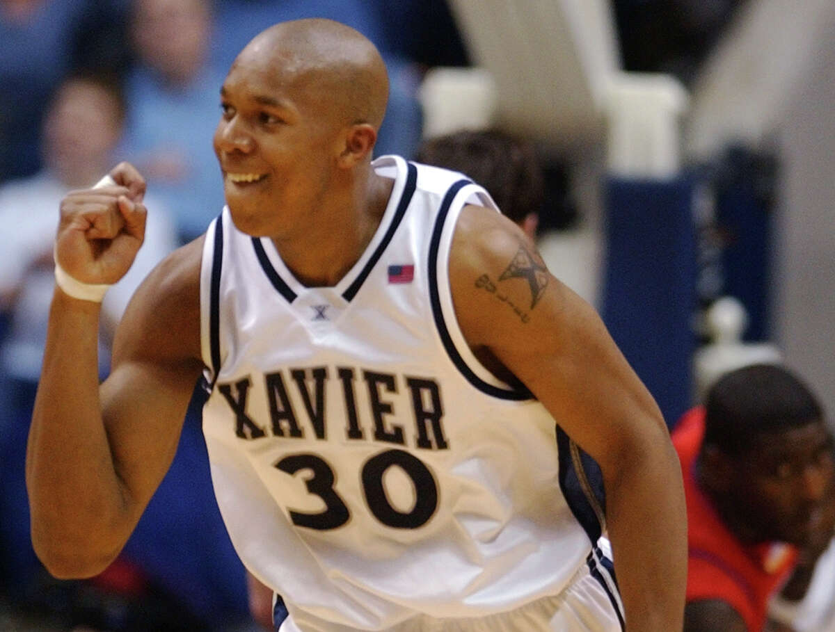 Xavier center David West reacts after scoring against Dayton in the second half, Saturday, Feb. 8, 2003, in Cincinnati. West scored a career high 47 points to lead Xavier to an 85-77 win.