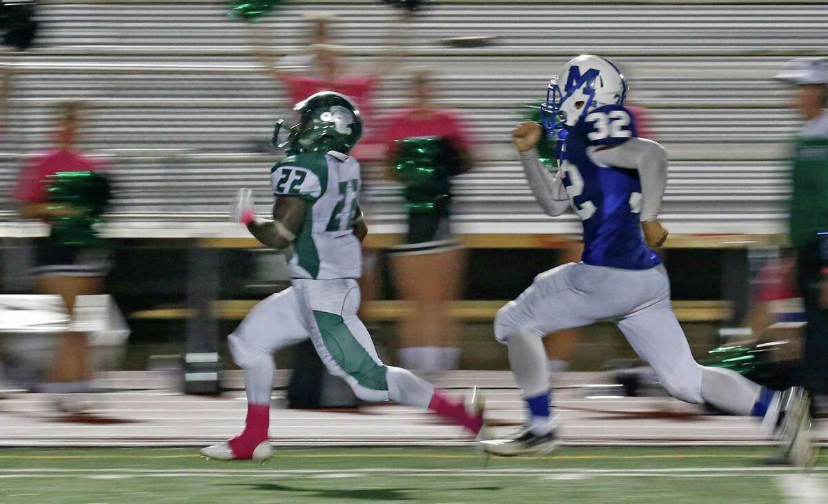 Reagan’s Marquis Duncan 66-yard TD in the fourth quarter help clinch the game as MacArthur’s Martin Apopot trails the play in the District 26-6A high school football contest at Comalander Stadium on Friday, October 23, 2015.