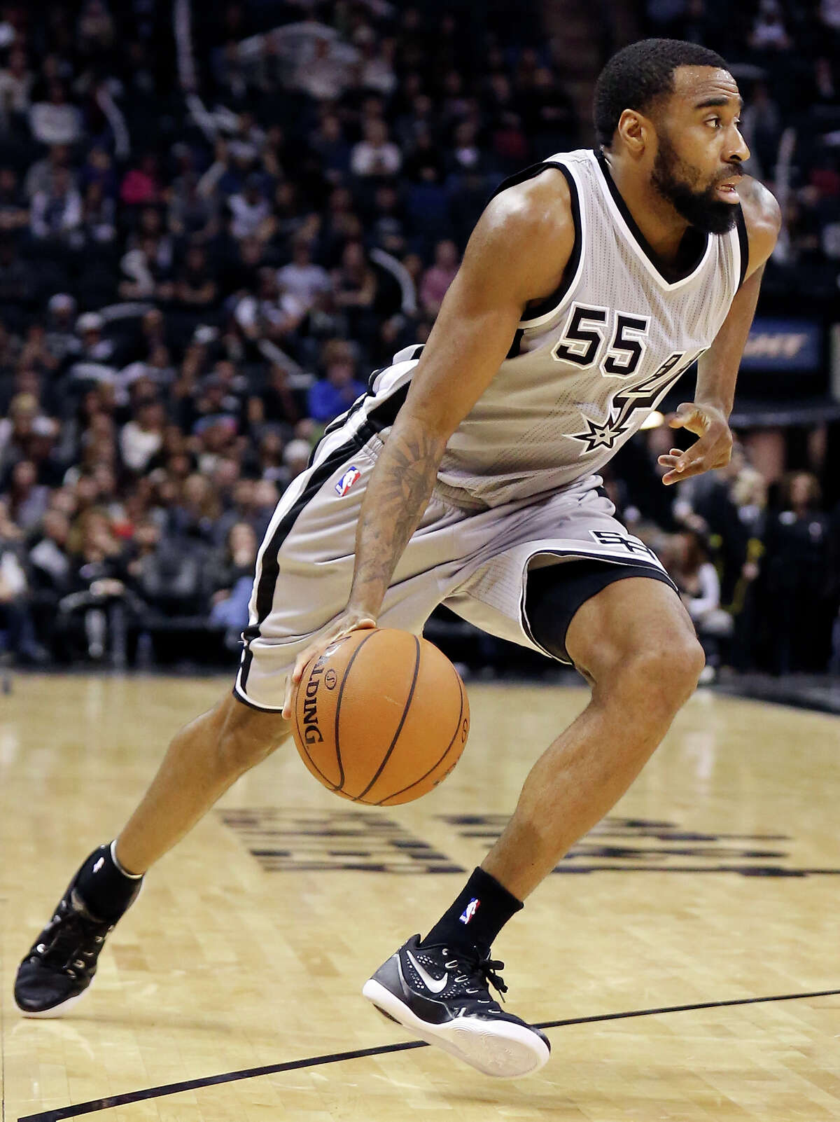 San Antonio Spurs' Reggie Williams heads up court against the Los Angeles Clippers during second half action Saturday Jan. 31, 2015 at the AT&T Center. The Clippers won 105-85.