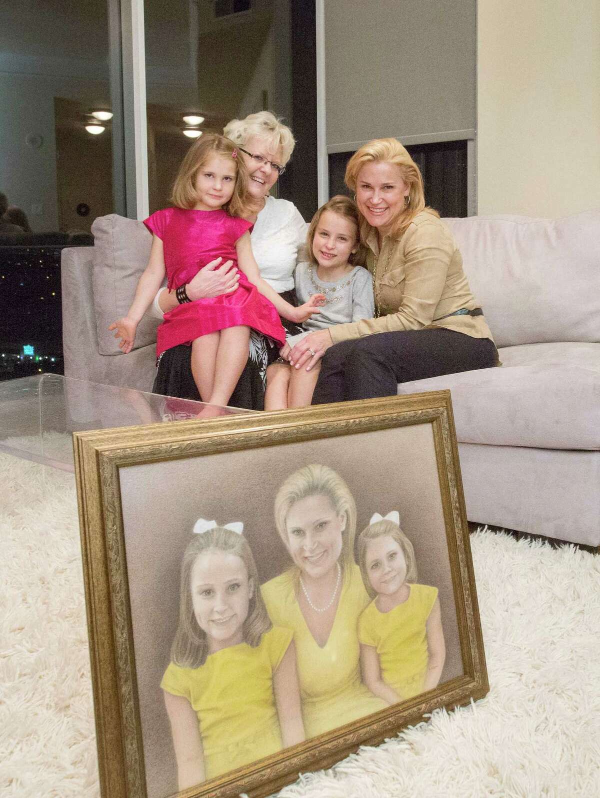 From left, Catherine Cruz, 4, Betty Odgaard, Caroline Cruz, 7, and Heidi Cruz, pose for a photo at a private residence Thursday, Oct. 22, 2015, in Houston. Odgaard, who was sued with her husband Richard for refusing to do same-sex marriages in their Grimes, Iowa gallery, drove from Dallas with her husband to give a pencil drawing to Cruz featuring her and her two daughters. ( Jon Shapley / Houston Chronicle )