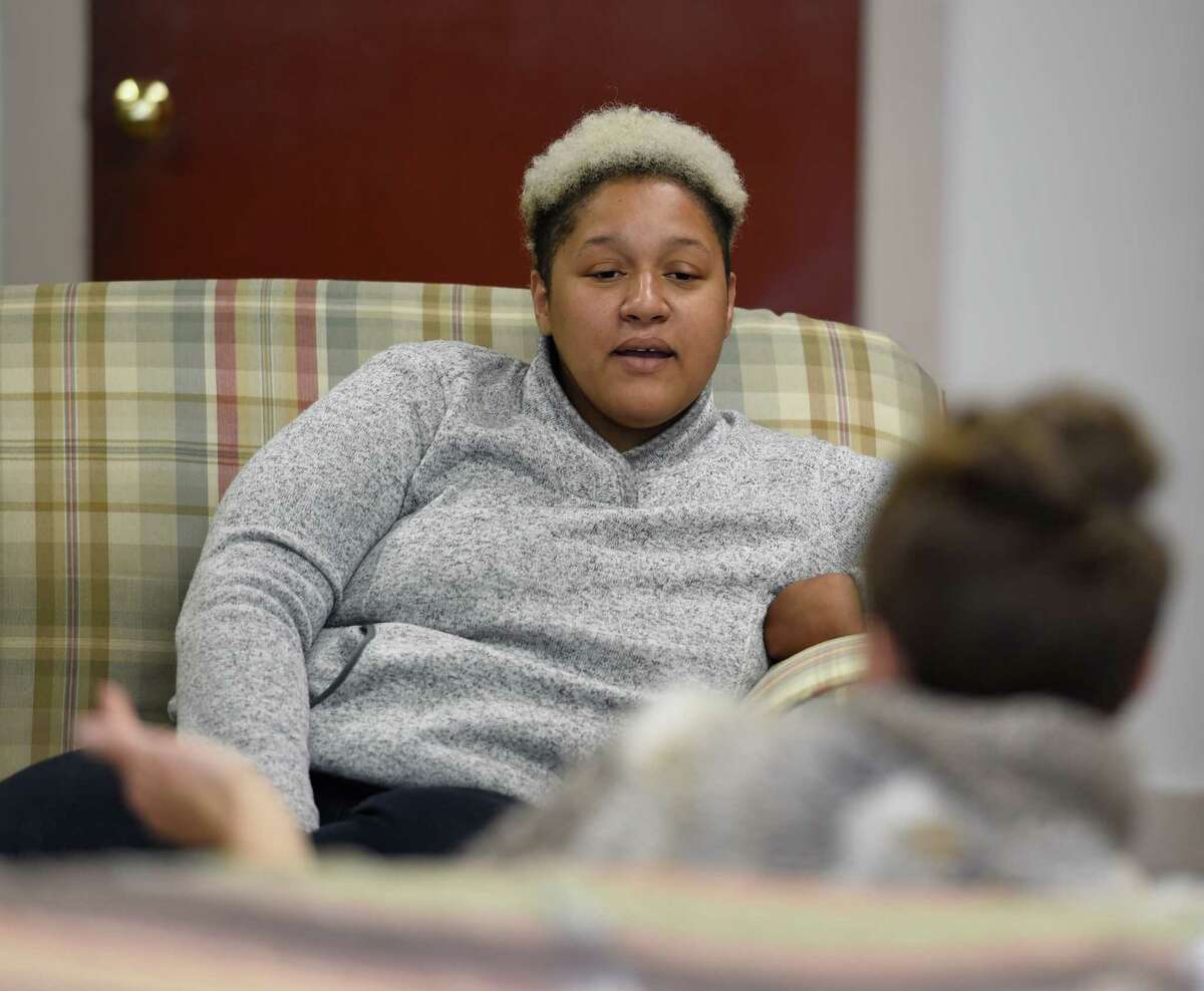 Angelica Clarke, executive director of the Social Justice Center, speaks with a visitor at her office Friday afternoon, Oct. 2, 2015, in Albany, N.Y. (Skip Dickstein/Times Union)