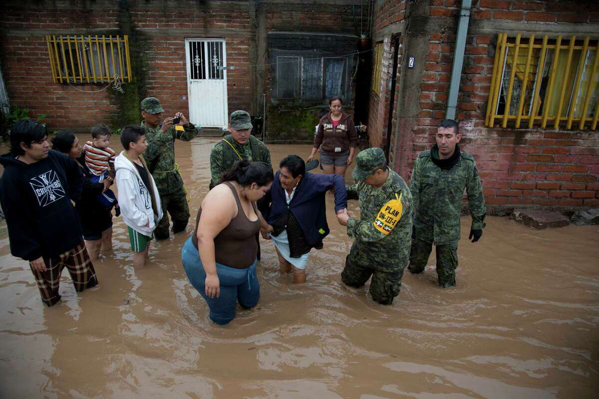 Raw Video Shows Texas Rescue Workers Pulling Dog, Man From Submerged ...