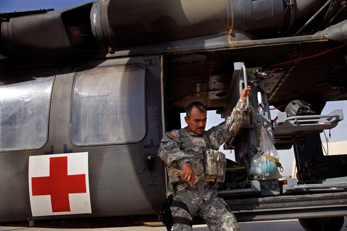 Sgt. First Class Juan Rendon, 48, of San Antonio, takes a break on the flight line at Joint Base Balad, Sunday, Sept. 21, 2008. Medical evacuation teams are on call for 24 hours and must be ready to fly at a moments notice. NICOLE FRUGE/nfruge@express-news.net