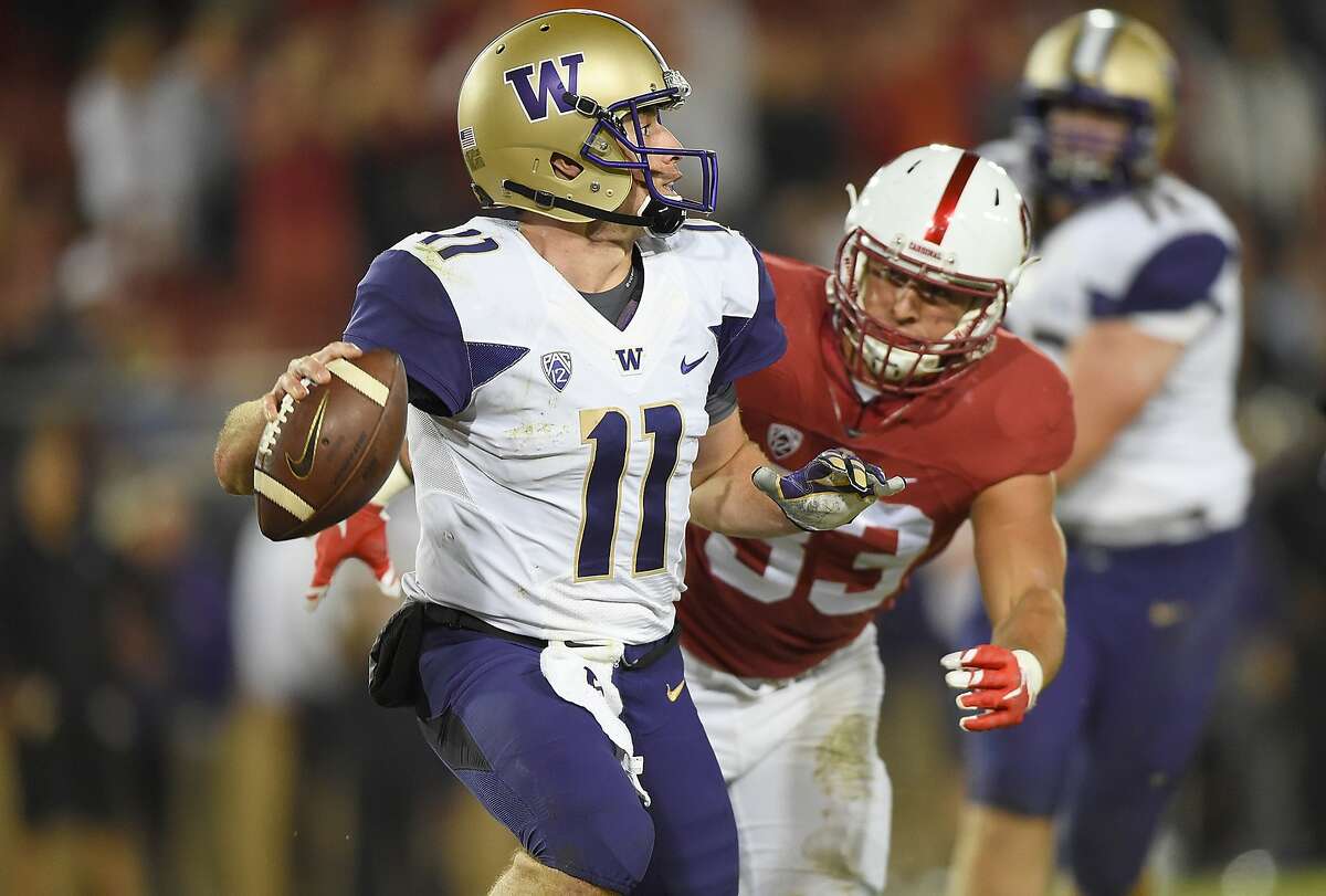 STANFORD, CA - OCTOBER 24: K.J. Carta-Samuels #11 of the Washington Huskies looks to get his pass off under pressure from Mike Tyler #33 of the Stanford Cardinal's in the fourth quarter of an NCAA football game at Stanford Stadium on October 24, 2015 in Stanford, California. (Photo by Thearon W. Henderson/Getty Images)