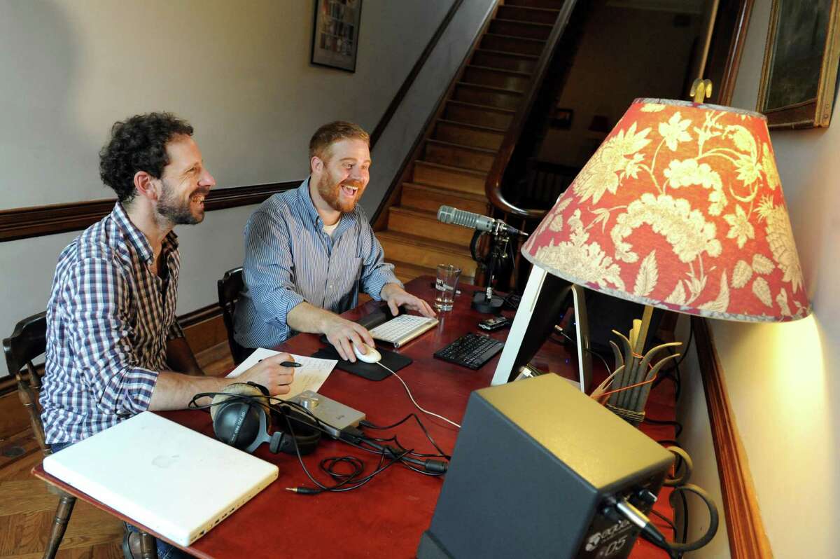 Creator and host Duncan Crary, right, and engineer Ian White work on an episode of "A Small American City" podcast at White's home in Troy, N.Y. (Cindy Schultz / Times Union)