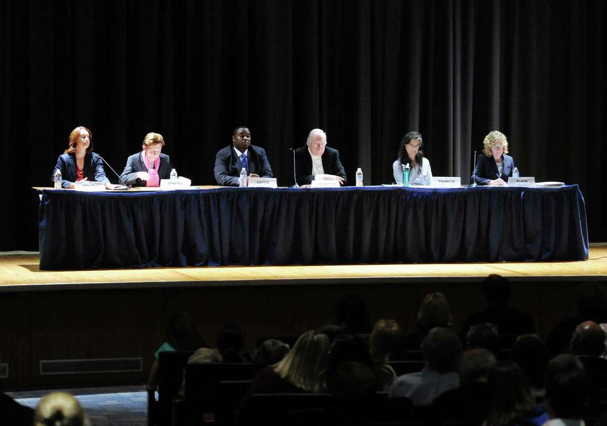 Scool board candidates, from left, Jennifer Dayton, a Democratic incumbent, Barbara O'Neill, a Republican incumbent, Anthony Lopez, a Democrat, Peter Von Braun, a Republican incumbent, Gaetane Francis, a Democrat, and Lauren Rabin, a Republican, during Tuesday’s candidates forum at Central Middle School.