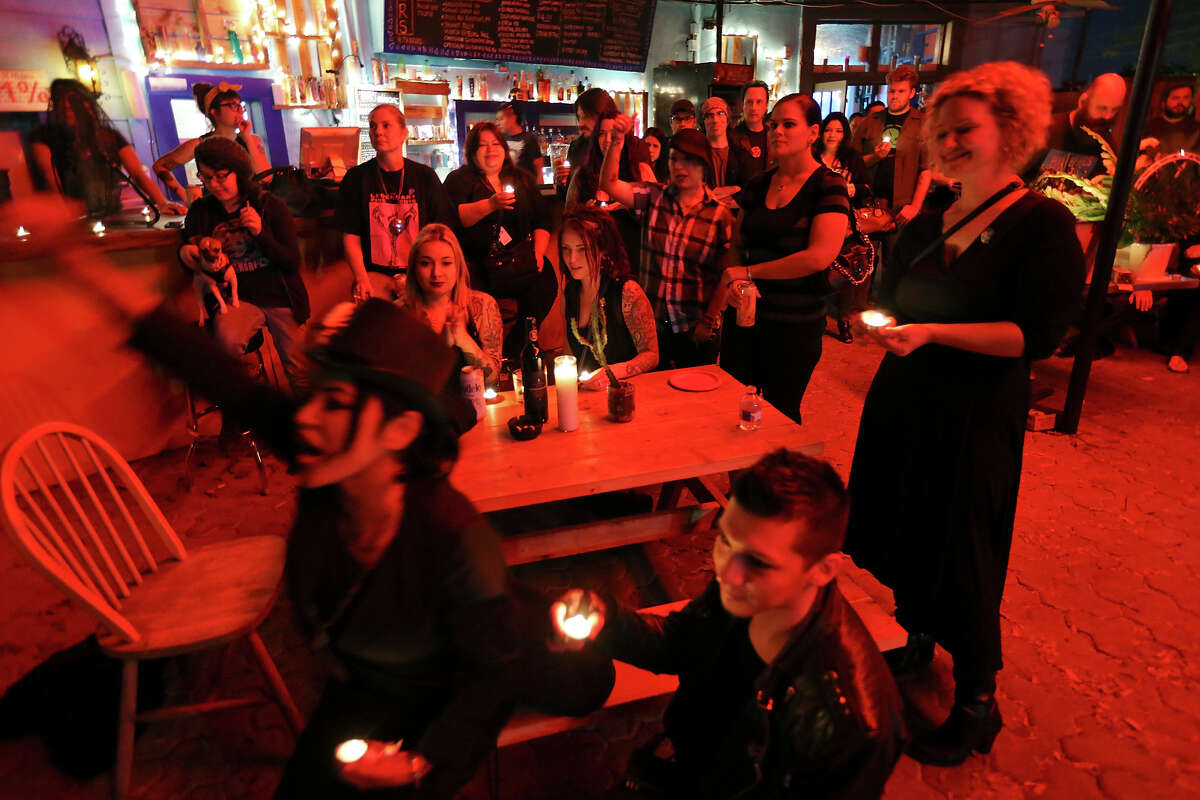 Family and friends attend a memorial, at La Botanica Monday Oct. 26, 2015, for musician Shawn Terry, a fixture on the St. Mary's Strip with such bands as the Mechanical Walking Robotboy and Guilty Strangers. Terry died on Saturday from complications of cancer after being diagnosed in the fall.
