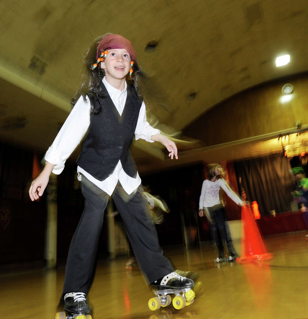 Caleb Fockens, 8, of Old Greenwich, wears a pirate custome during the Friday Night Halloween Skate at the Old Greenwich Civic Center, Oct. 28, 2011.