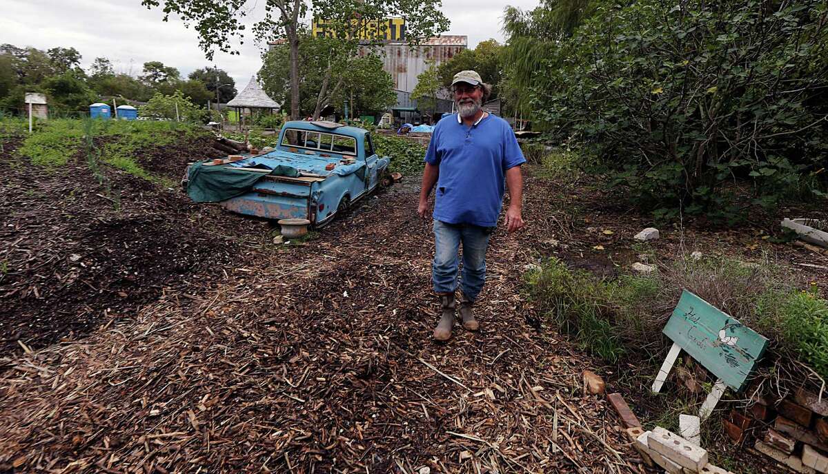 Last Organic Outpost founder Joe Icet walks on the urban farm in the Fifth Ward.