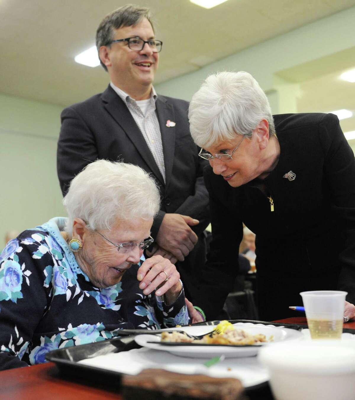 Senior Ruth Wilson, left, laughs with Connecticut Lt. Gov. Nancy Wyman and First Selectman nominee Frank Farricker at the Senior Center in Greenwich, Conn. Tuesday, Oct. 27, 2015. Lt. Gov. Wyman came down from Hartford Tuesday to show her support for Farricker in next Tuesday's election.