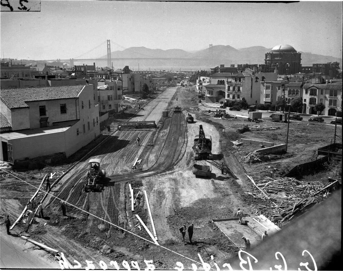 Workers build a roadway through the Marina District to the Golden Gate Bridge, 1936.