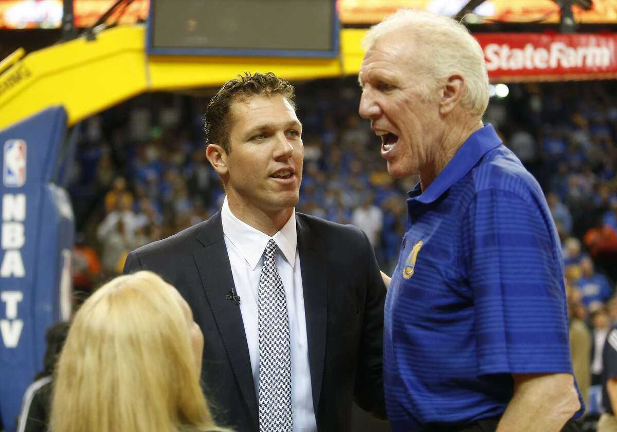 Golden State Warriors' interim head coach Luke Walton listens to his father Bill Walton before Warriors played New Orleans Pelicans during NBA game at Oracle Arena in Oakland on Tuesday, October 27, 2015.