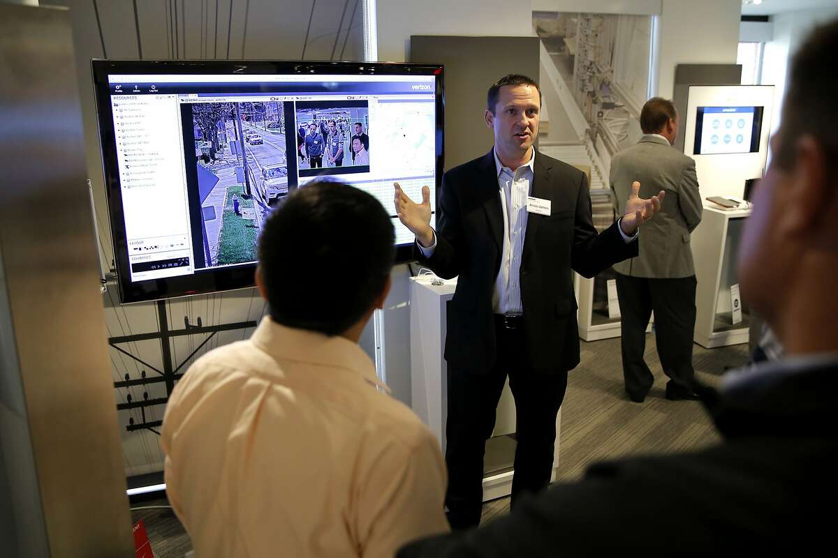 Jesse James (right) explains intelligent video systems during a Verizon demonstration of products using the Internet of Things in San Francisco, California, on Wednesday, Oct. 28, 2015.