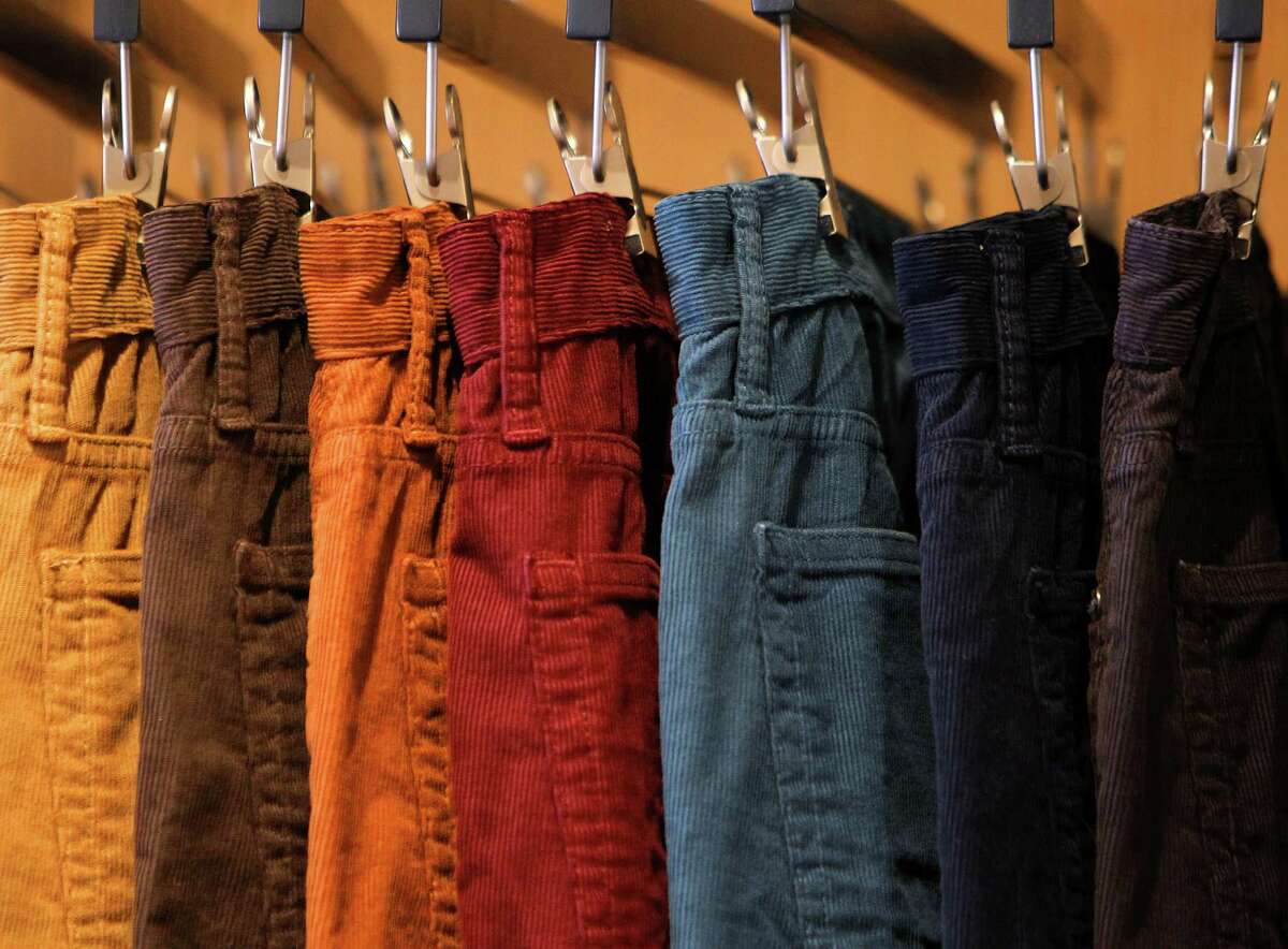 Different styles of pants hang at the new Bonobos Guideshop in River Oaks, Wednesday, Oct. 28, 2015, in Houston. The Guideshop allows men to come into the store, try clothes on, and then order the clothes online to be delivered to their door.