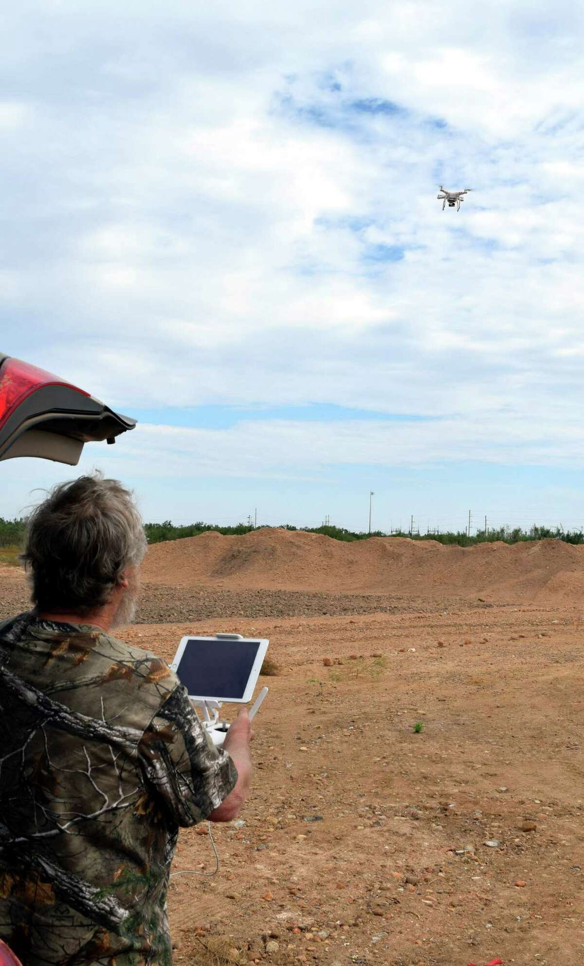 Lifting off after being program for a specific flight pattern, this drone being put into use by Jim Raby of San Antonio has helped the hunter use high-tech to help monitor his hunting area.