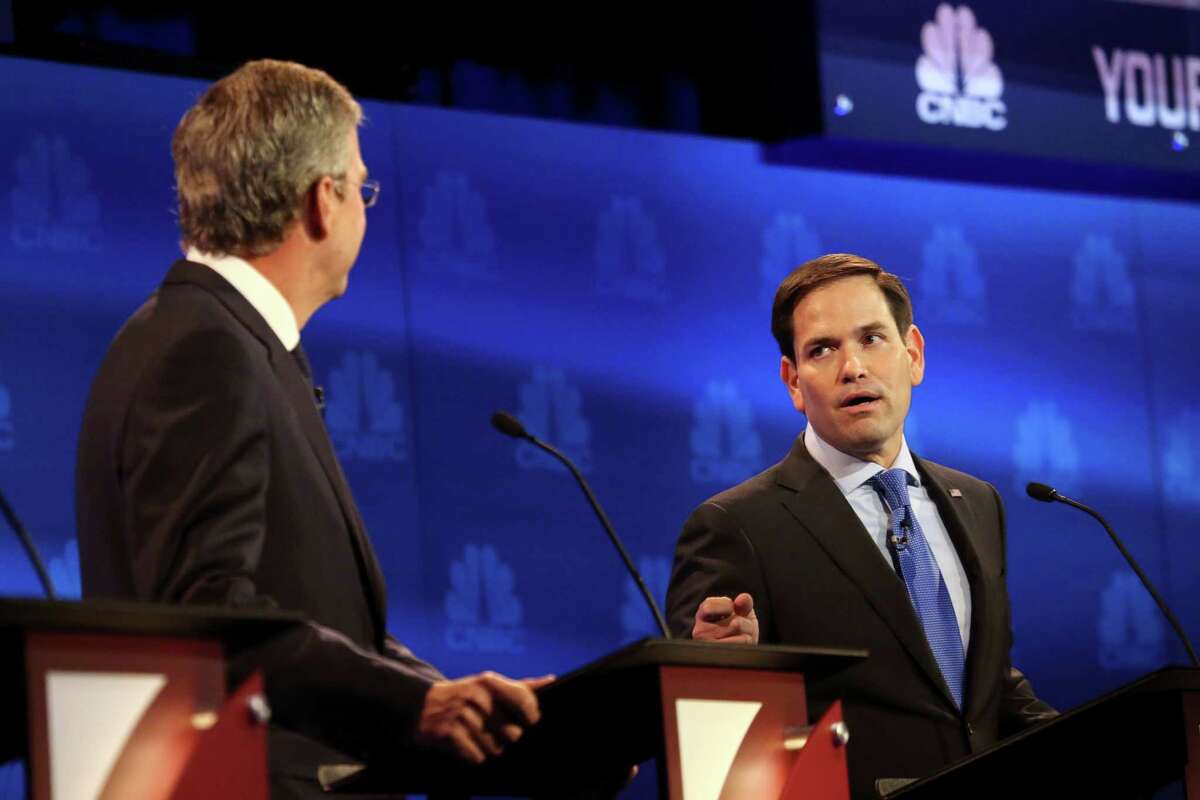 Sen. Marco Rubio spars with Jeb Bush, left, during the debate of Republican presidential hopefuls at the University of Colorado in Boulder, Oct. 28, 2015. Rubio said recent criticism of his attendance record in the Senate was off-base and an example of media bias against conservative candidates. (Jim Wilson/The New York Times)
