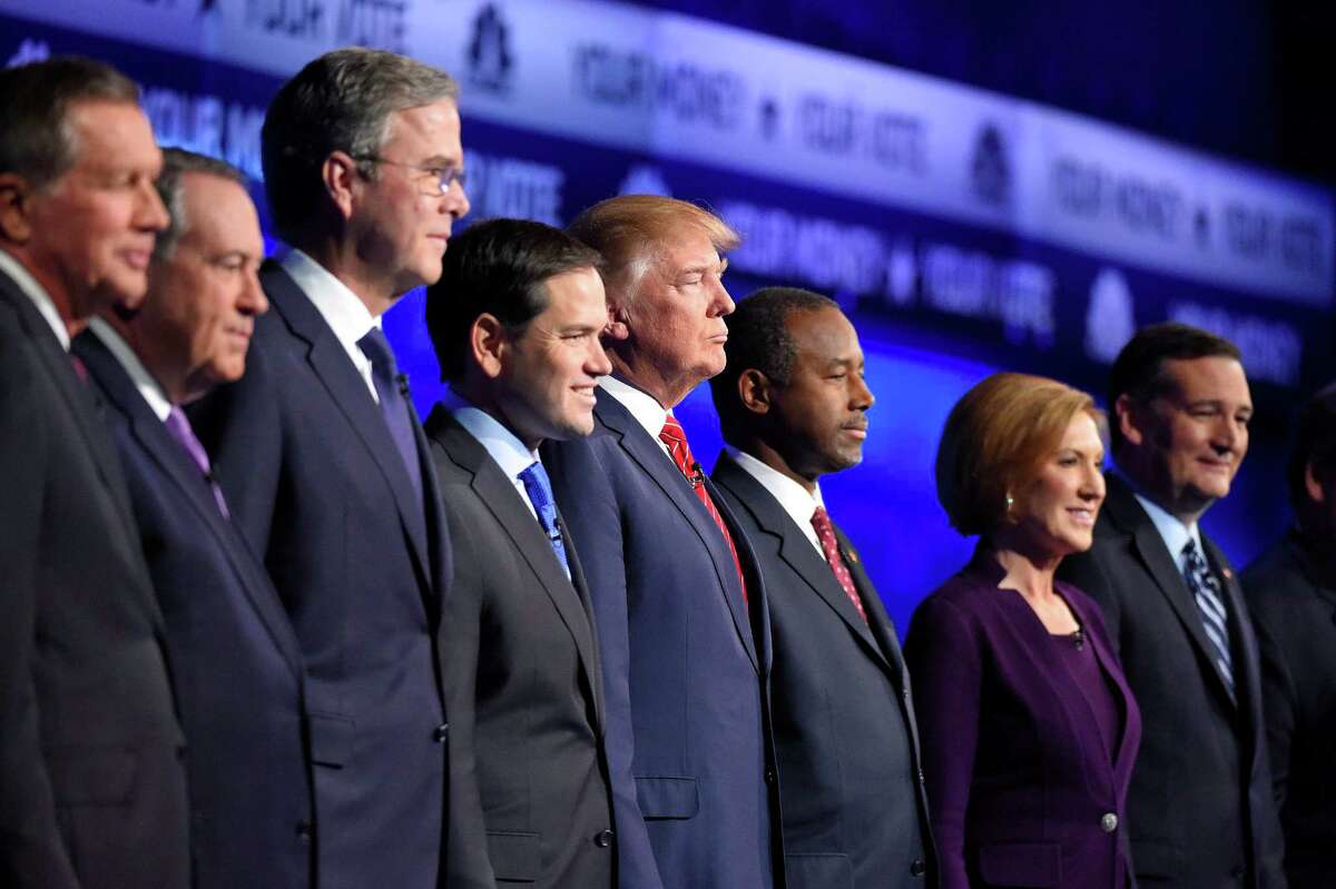 Republican presidential candidates, from left, John Kasich, Mike Huckabee, Jeb Bush, Marco Rubio, Donald Trump, Ben Carson, Carly Fiorina, and Ted Cruz take the stage during the CNBC Republican presidential debate at the University of Colorado, Wednesday, Oct. 28, 2015, in Boulder, Colo. (AP Photo/Mark J. Terrill)