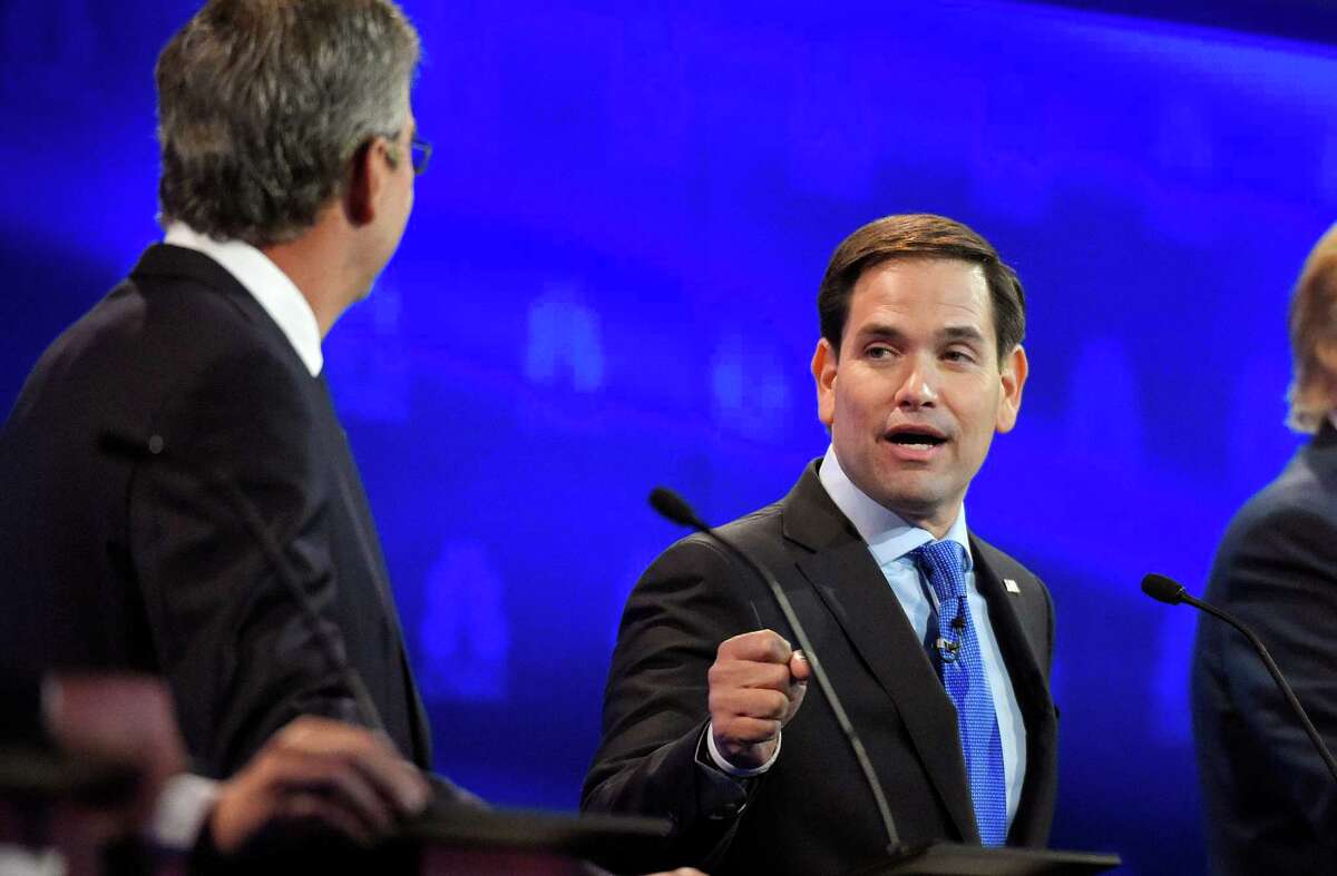Marco Rubio, right, and Jeb Bush, argue a point during the CNBC Republican presidential debate at the University of Colorado, Wednesday, Oct. 28, 2015, in Boulder, Colo. (AP Photo/Mark J. Terrill)
