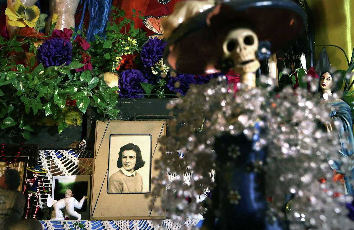 An early photograph of Connie Means is seen on the alter created by David Zamora Casas in his home on Tuesday, Oct. 27, 2015, to honor her during Dia de Los Muertos.