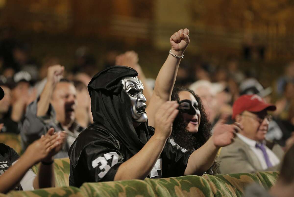 Oakland Raiders fans cheer comments from Mayor Libby Schaaf as members of NFL Commissioner Roger GoodellÕs staff held a public hearing on the idea of the Raiders football team moving to southern California at the Paramount Theater in Oakland, Calif., on Thursday, October 29, 2015.