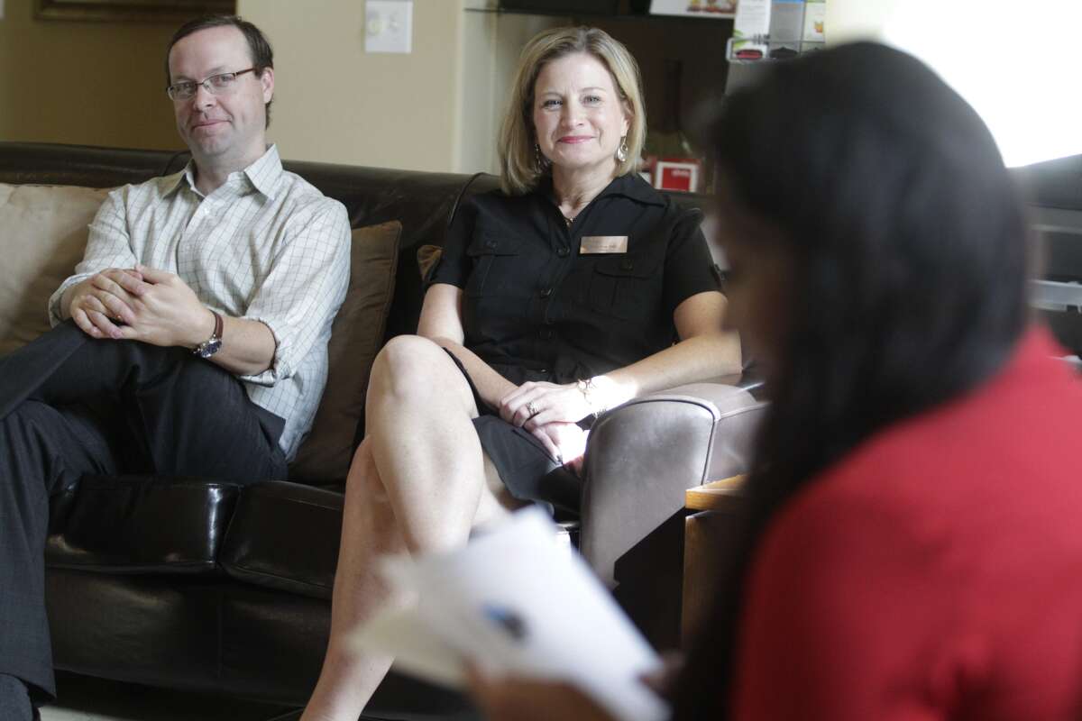 Venterra Realty Director of Property Management Bryan George and Senior Regional Manager Lissa May listen to apartment manager Adriana Reagan during a weekly "huddle" employees meeting at the Silverbrooke Apartments. (J. Patric Schneider/For the Chronicle)