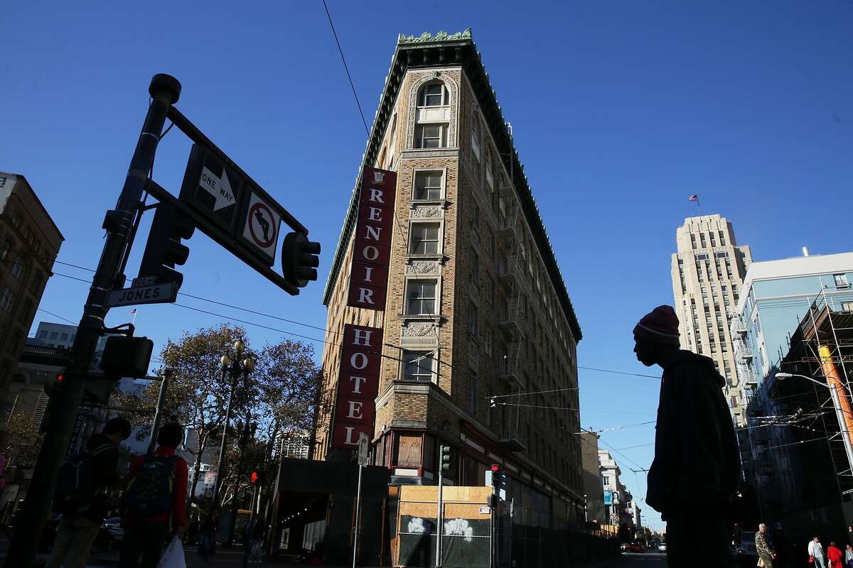 Pedestrians cross the street next to the Renoir Hotel on Thursday, October 29, 2015 in San Francisco, Calif.