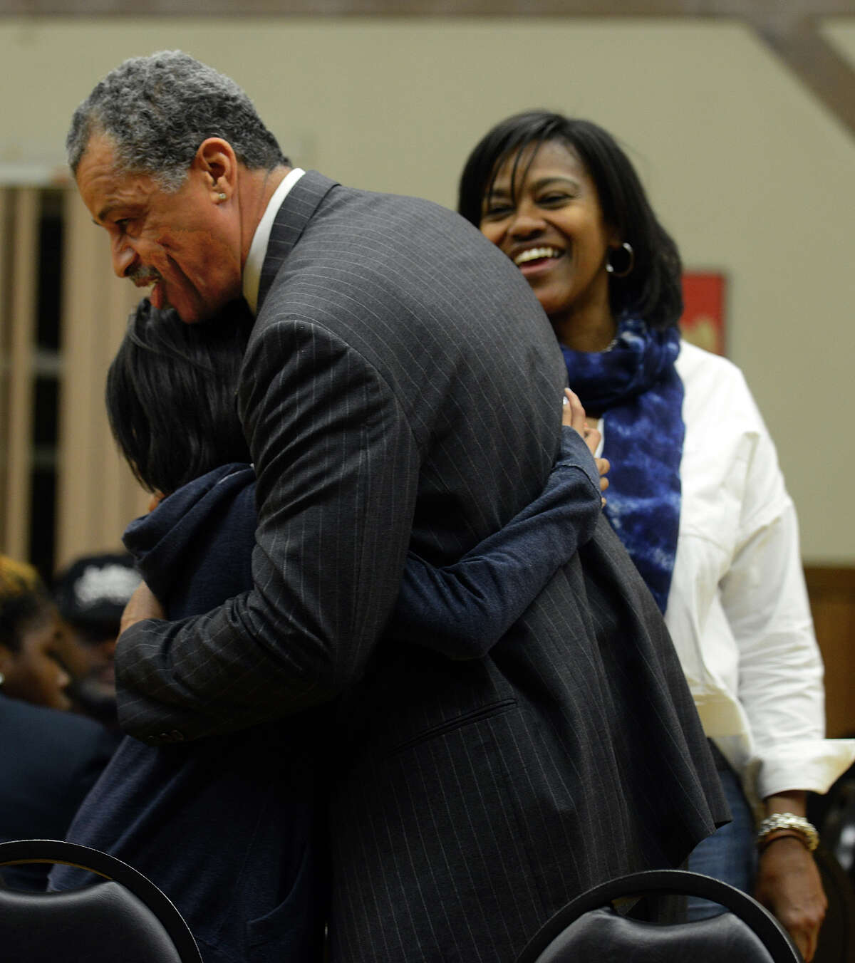 Bridgeport Mayoral candidate David Daniels hugs Jordan Whichard, 12, as mom Gina looks on, during a fundraiser for Daniels at the Germania Schwaben Club in Bridgeport, Conn., on Thursday October 22, 2015.