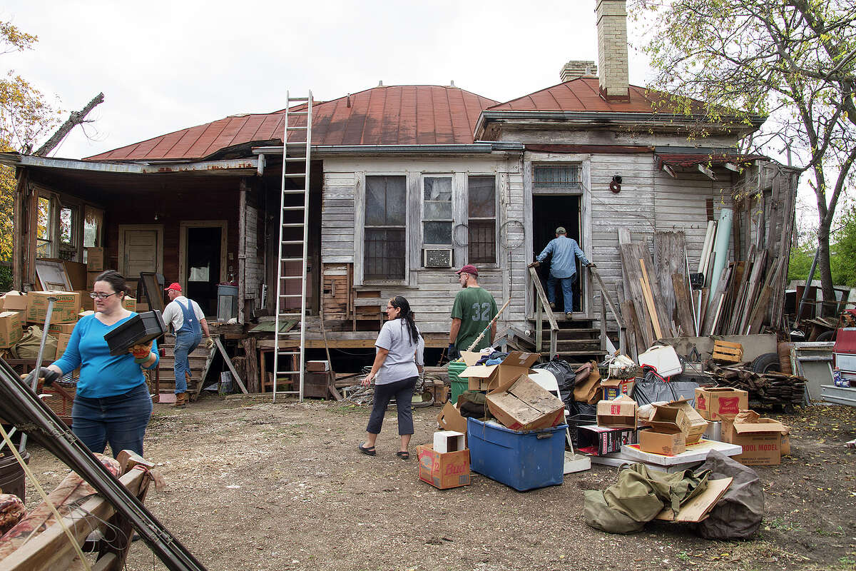 The back of Miguel Calzada's home, Saturday, Dec. 13, 2014. Volunteers helped clear out the home to prepare for renovations to the home.