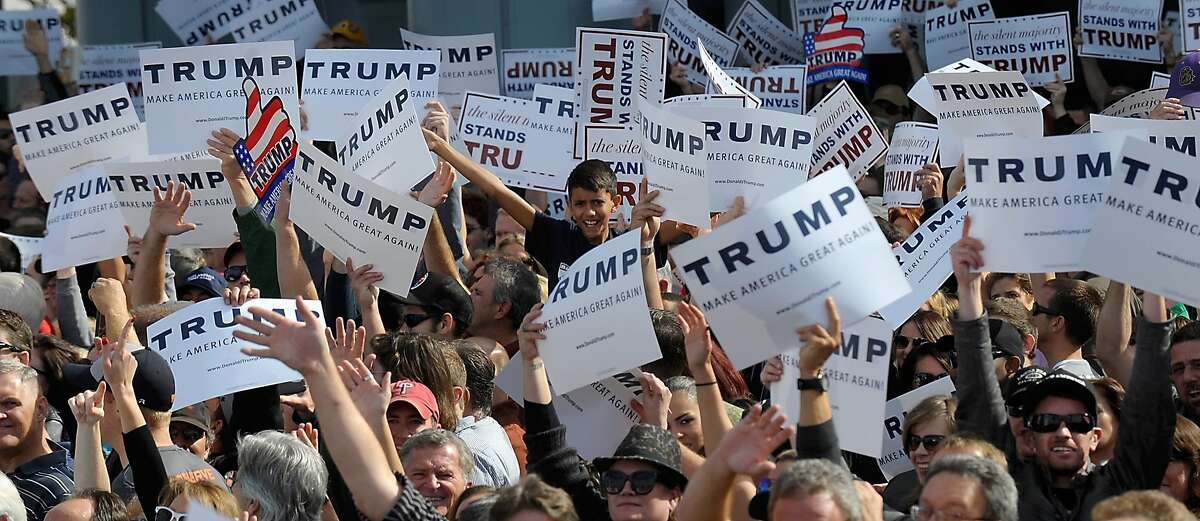 NORFOLK, VA - OCTOBER 31: Supporters cheer at a rally for Republican presidential candidate Donald Trump held at a rally in front of the USS Wisconsin on October 31, 2015 in Norfolk, Virginia. . With just 93 days before the Iowa caucuses Republican hopefuls are trying to shore up support amongst the party. (Photo by Sara D. Davis/Getty Images)