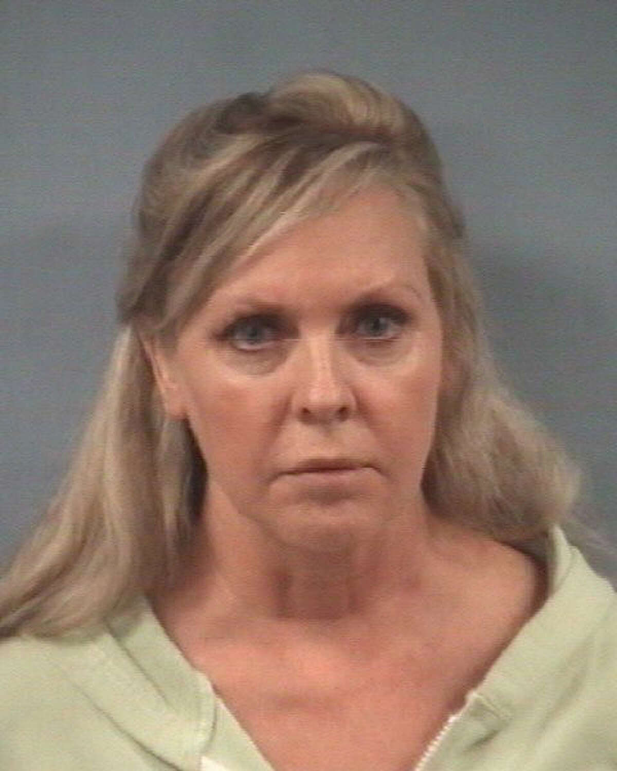 Kelly Meadows Kennedy, 56, was charged with furnishing alcohol to minors and violating the open party ordinance.