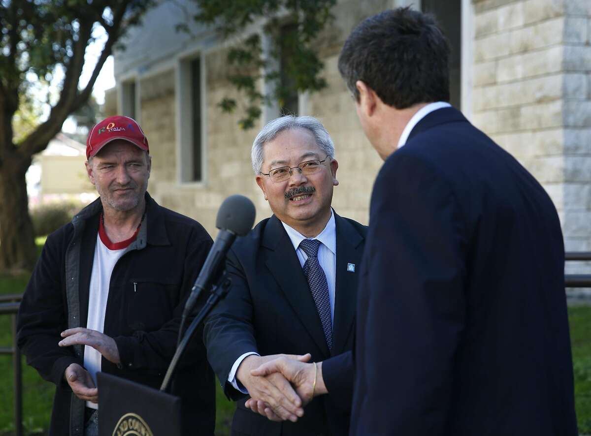 Mayor Ed Lee meets with Michael Blecker (right), executive director of Swords to Plowshares, at a dedication ceremony for veterans housing at the Presidio in San Francisco, Calif. on Tuesday, Nov. 3, 2015.