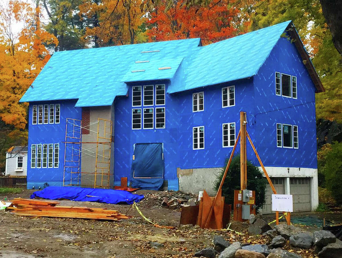 The Big Blue House on Old Church Road in Greenwich is wrapped in Blueskin, a new adhesive house wrap designed to revolutionize the construction process. The home is the first in Greenwich to use the new product.