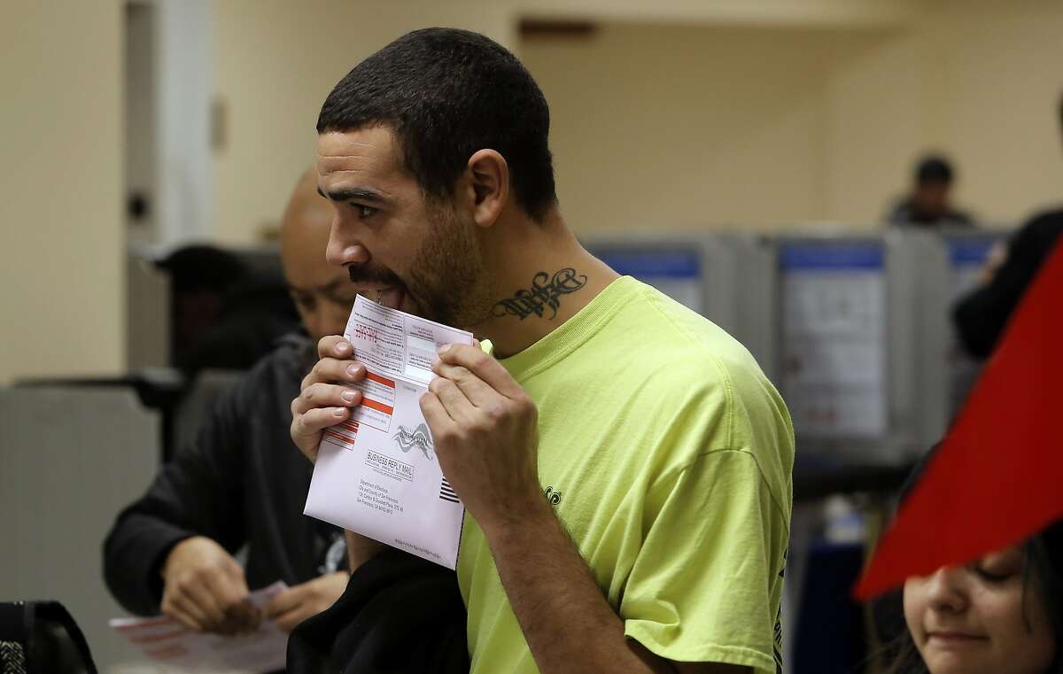 Voter Nick Parker seals his ballot after voting at the City Hall polling place, during election day in San Francisco , Calif. on Tues. November 3, 2015.