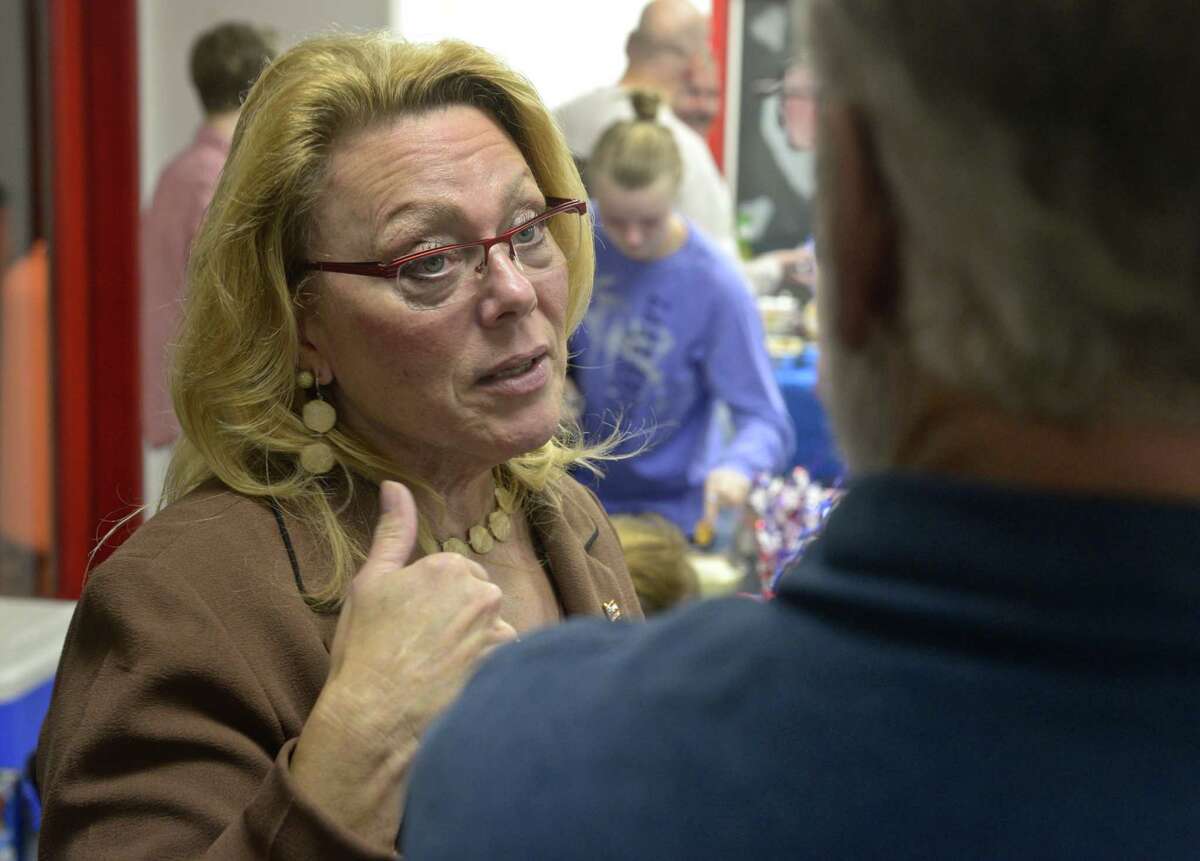 Six term incumbent New Milford Mayor Pat Murphy talks with a supporter at Republican Headquarters on election night, Tuesday, November 3, 2015, in New Milford.