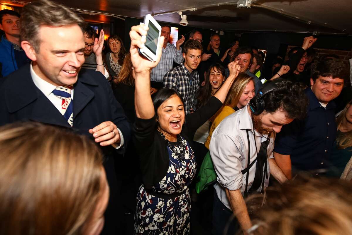 Let's Move Seattle campaign co-chair Shefali Ranganathan (center) celebrates just after seeing that Proposition 1, the transportation property tax levy took 56.53 percent of the vote, Tuesday night at the Belltown Pub. Photographed Nov. 3, 2015.