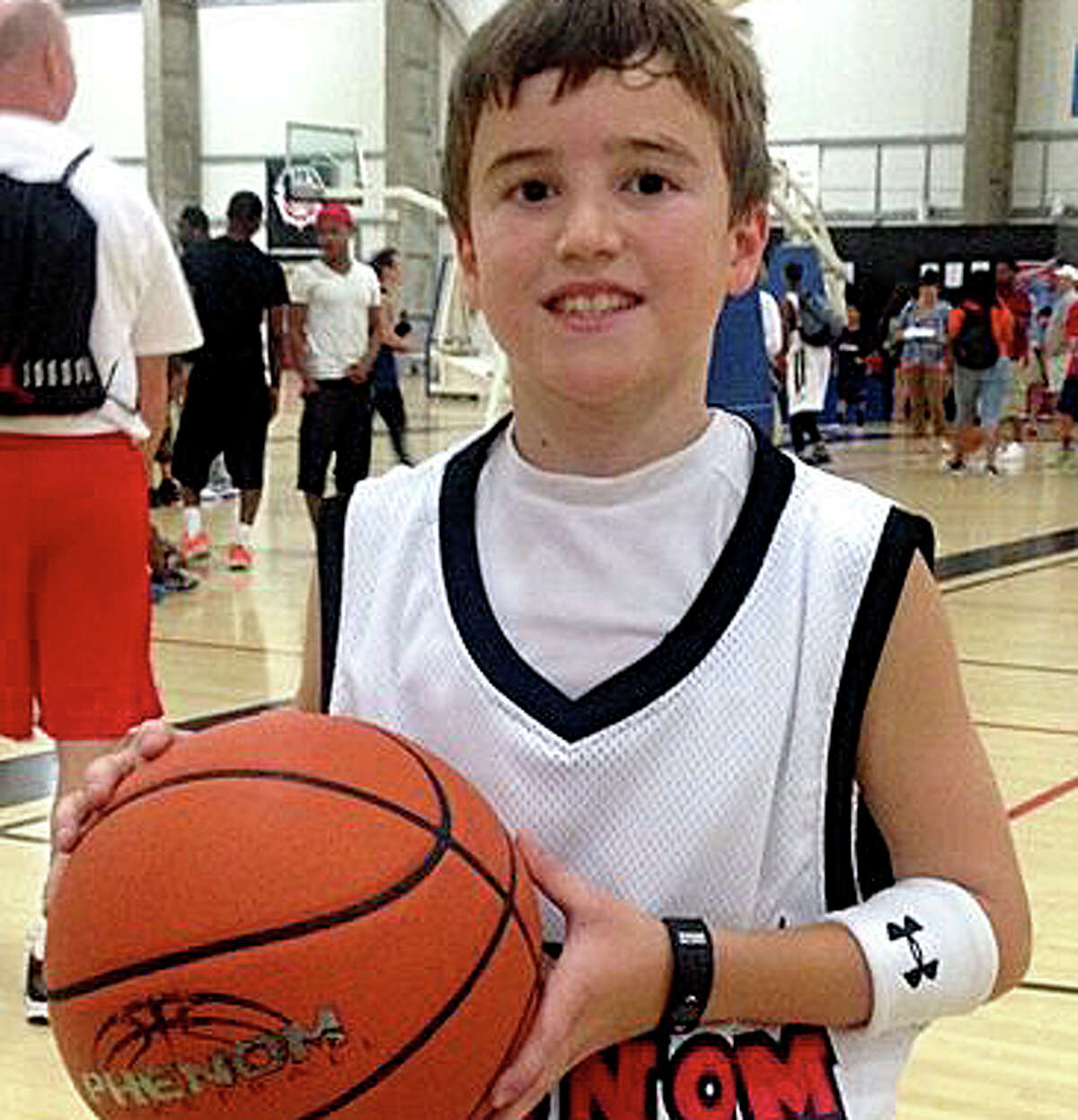 The Adam Greenlee Foundation is helping to organize a campaign to make automated external defibrillators available at all of the town's school athletics facilitie, as well as portable AEDs for Westport students on the road. In 2014, Adam Greenlee Jr., pictured, then a sixth-grader at Bedford Middle School, suffered a seizure and cardiac arrest, but was revived by staff who treated him with an AED and cardio-pulmonary resuscitation before he was taken to a hospital.