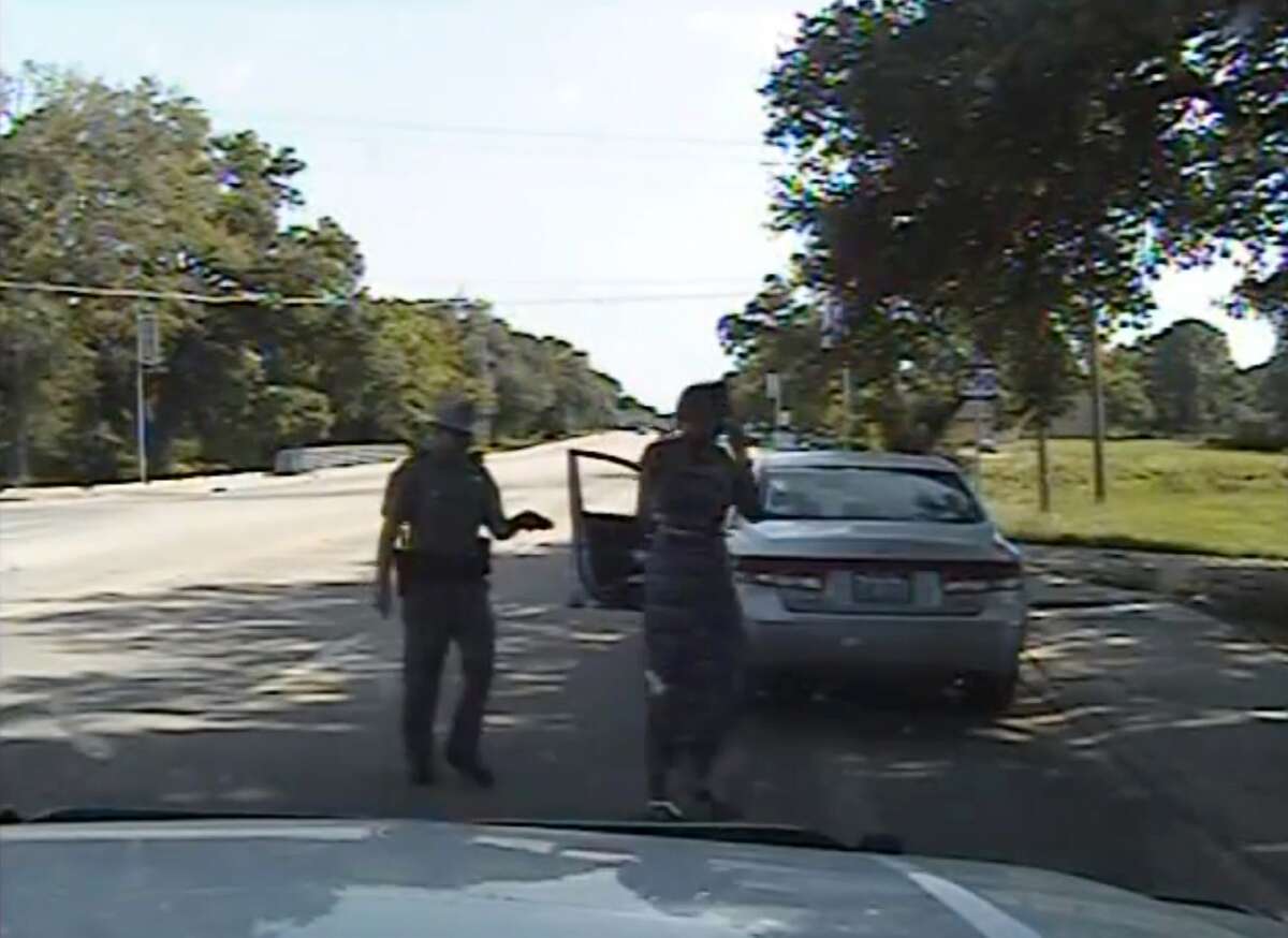 In this July 10, 2015 file frame from dashcam video provided by the Texas Department of Public Safety, trooper Brian Encinia arrests Sandra Bland after she became combative during a routine traffic stop in Waller County, Texas. Encinia, a Texas trooper who arrested Bland after a confrontation that began with a traffic stop, had been cautioned about ?“unprofessional conduct?” in a 2014 incident while he was still a probationary trooper. (Texas Department of Public Safety via AP, File)
