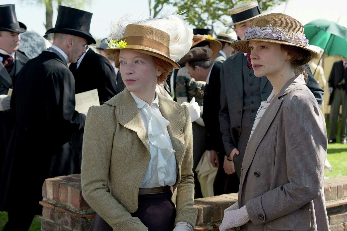 In this image released by Focus Features, Natalie Press portrays Emily Wilding Davison, left, and Carey Mulligan portrays Maud Watts in a scene from "Suffragette." (Steffan Hill/Focus Features via AP)