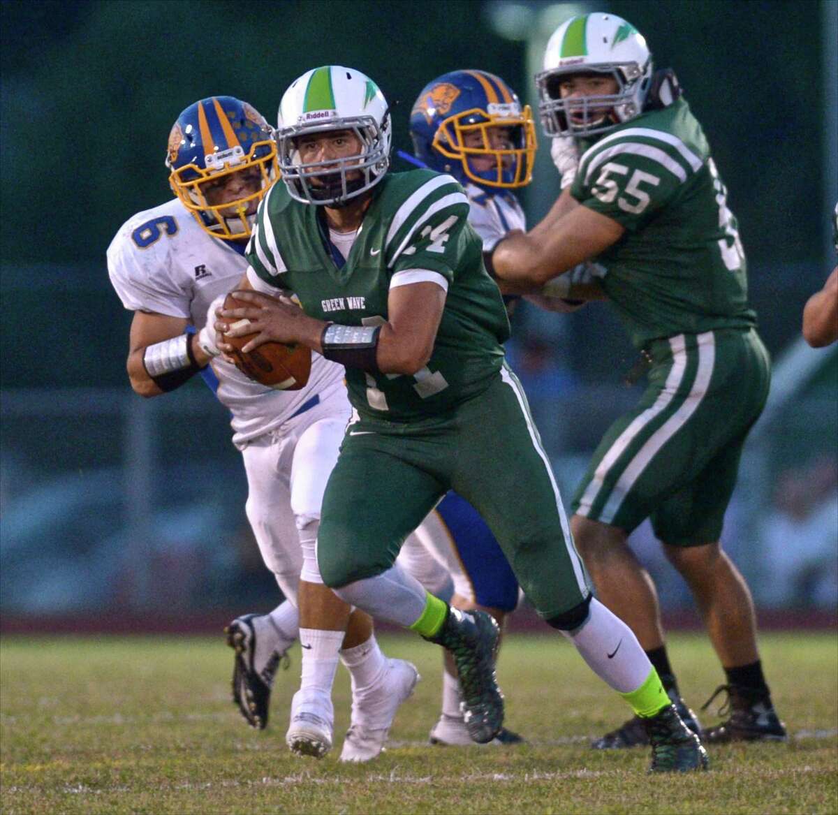 Tyler Hansen (14) Photographs from the high school football game between Brookfield and New Milford high schools on Friday night, September 18, 2015, played at New Milford High School, in New Milford, Conn.