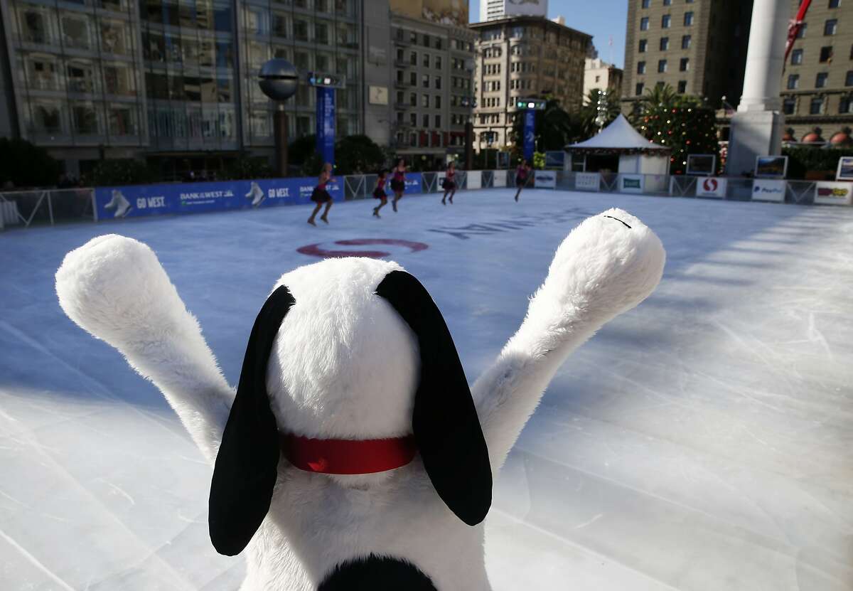 Snoopy cheers for a performance by the Tremors synchronized skating team at the official opening of the holiday season ice skating rink on Union Square in San Francisco, Calif. on Wednesday, Nov. 4, 2015.