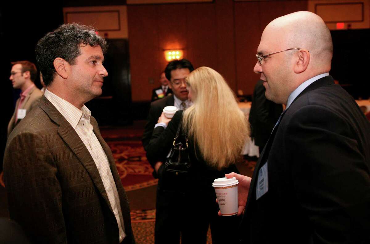 In this file photo, Stuart Sternberg, left, Principal Owner and General Managing Partner of the Tampa Bay Rays speaks with Greenwich resident and risk manager Aaron Goldberg at the Global Alpha Forum at the Hyatt Regency Greenwich. The event returns to Greenwich next week.