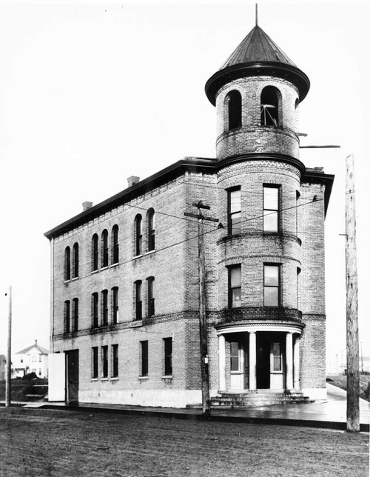 Ballard's old City Hall included the fire department, city offices, community meeting rooms, a ballroom and the jail, according to Seattle Municipal Archives caption information. This photo from 1902 shows the building five years before Ballard cast off its independence in favor of joining Seattle. The building was torn down in 1965. Photo courtesy Seattle Municipal Archives, University of Washington Special Collections, A. Curtis 00881.