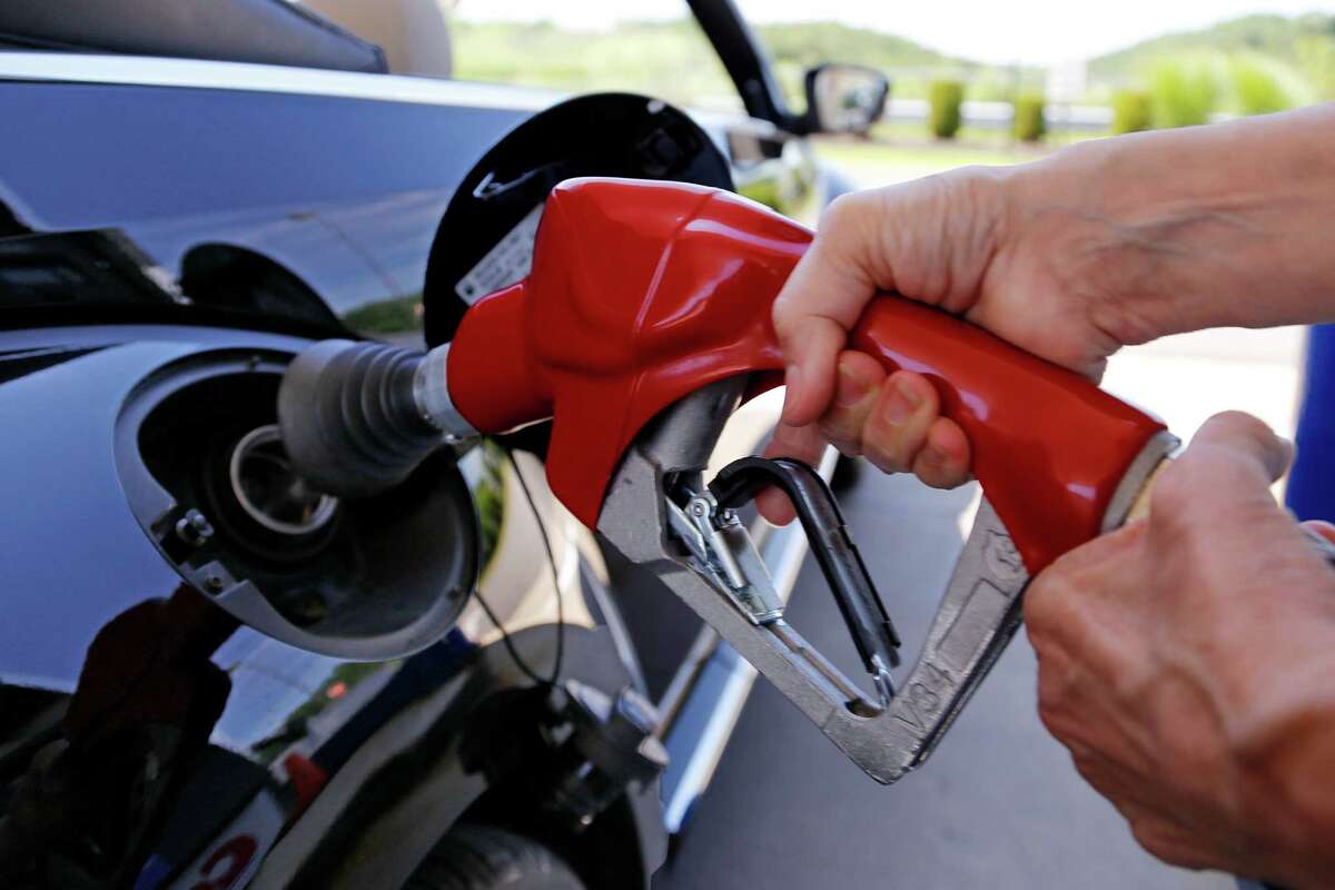 Most Americans will spend less than $2 per gallon for gasoline this holiday season. (AP Photo)