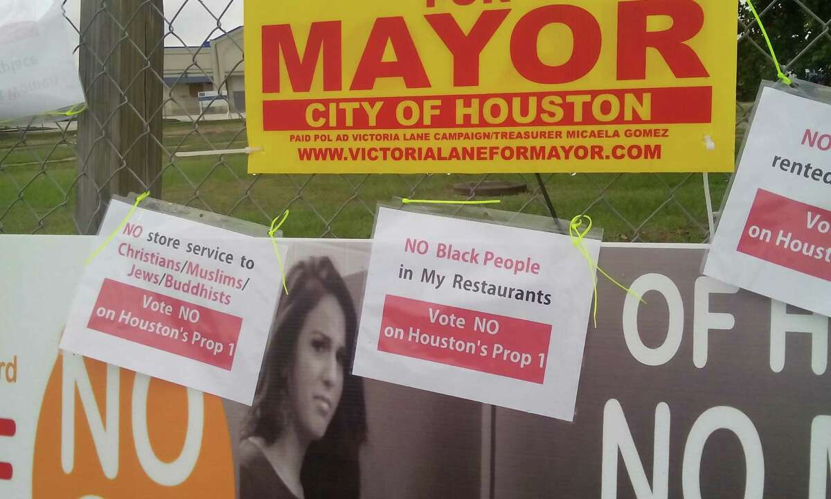 Signs posted around Houston mocking the "No Men in Women's Restrooms" hysteria.