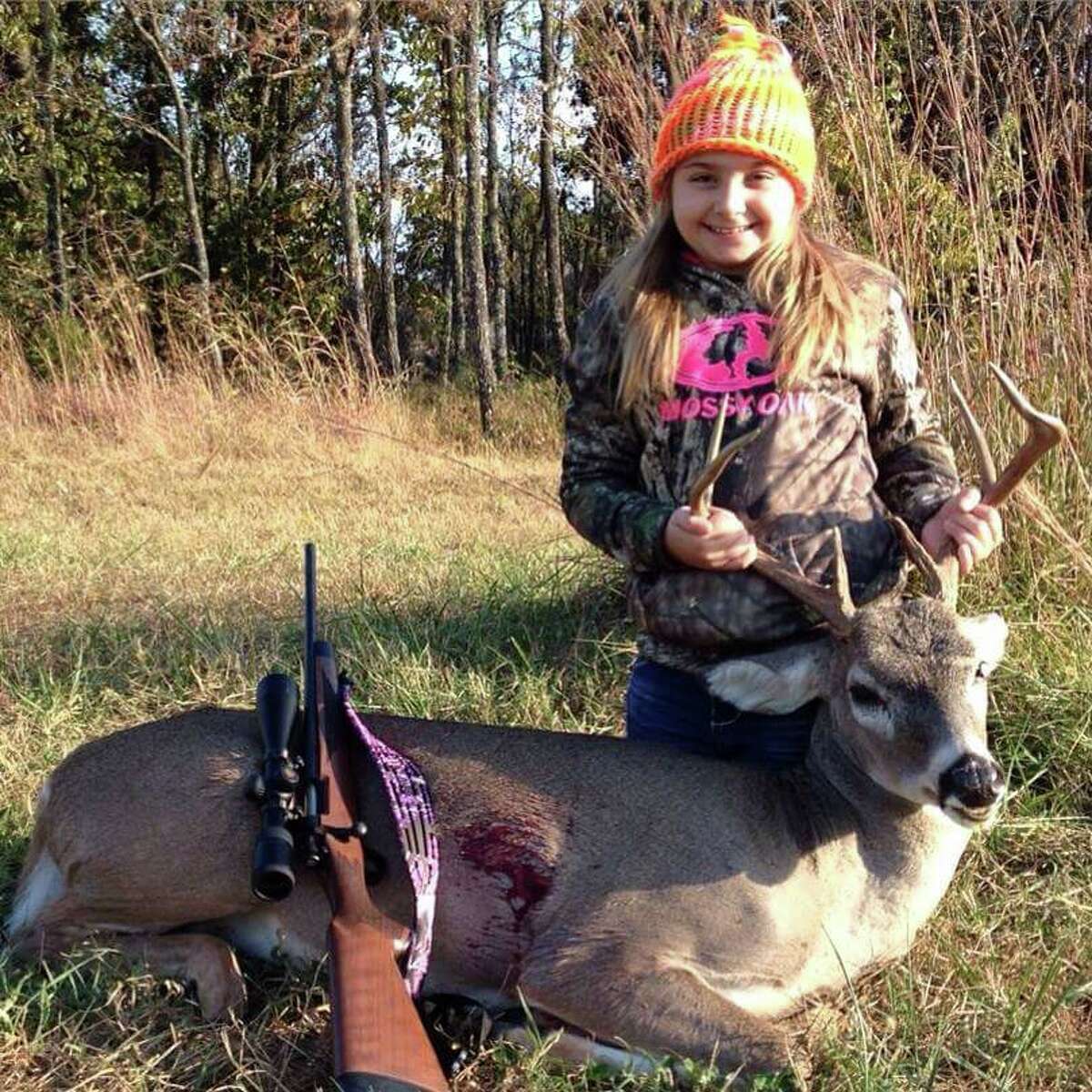 Emilee, age 9, almost 10, with her first buck. Photo from: Bill Derrick